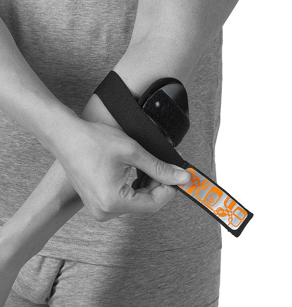 Elbow strap with adjustable pad for tennis and golf arm